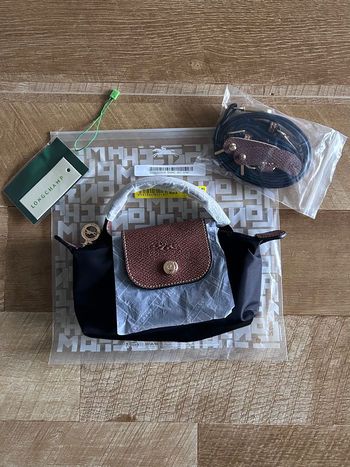 Sac à main femme Longchamp, toile noire / cuir marron.