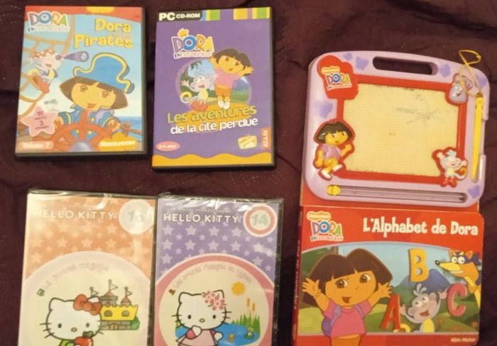 Lot pc 1 cd rom dora +2 DVD hello Kitty sous blister +1 livre ardoise magique dora