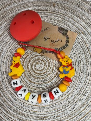 Attache tétine Winnie l’ourson