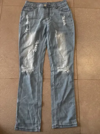Jean à trou bleu clair, taille S, bon état, 36x95cm