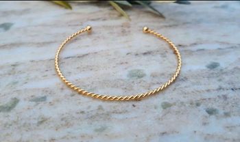 Bracelet jonc rigide torsadé plaqué or 18 carats neuf