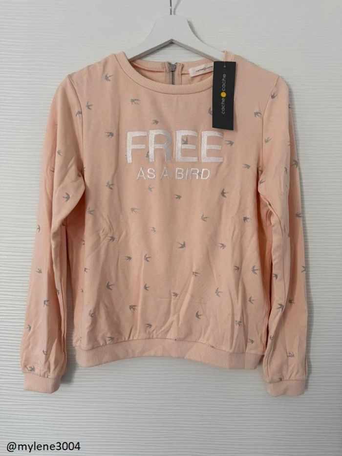 Sweat rose abricot motifs oiseaux et écritures à manches longues et fermeture éclair dos