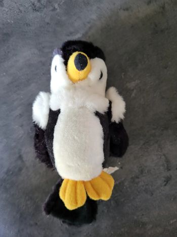 Petit oiseau hochet qui fait un bruit "clac clac" quand on le secoue