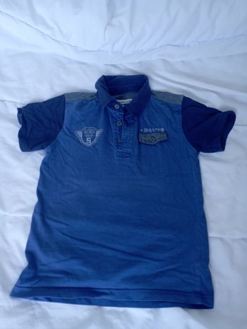 Polo bleu manches courtes 8 ans in extenso 2€5