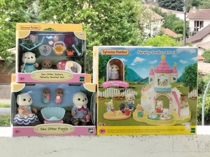 Sylvanian famille le bac à sable et piscine des bébés la famille loutre des mers les sœurs loutre des mers et pochette surprise