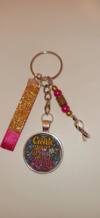 Cadeau pensées positives, porte clé message bijoux de sac " create your own reality"