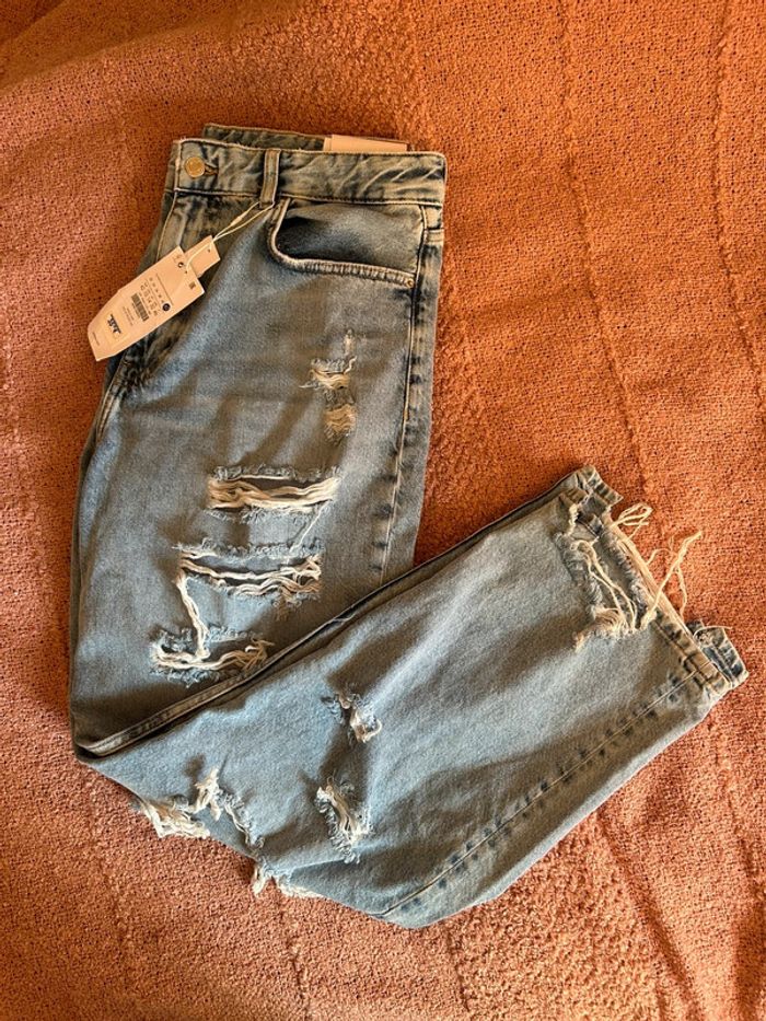 Jeans bleu clair effet déchiré • taille 42 - photo numéro 6