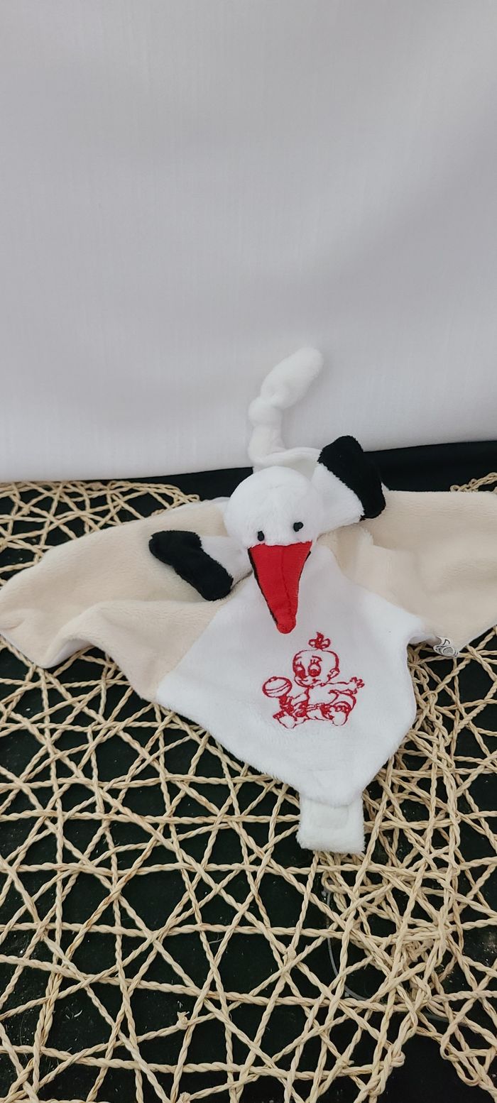 Doudou plat cigogne RODADOU RODA beige blanc 3 noeuds