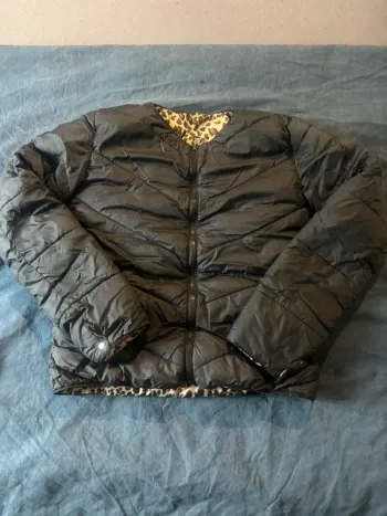 Veste torrente irréversible noir et léopard en très bon état