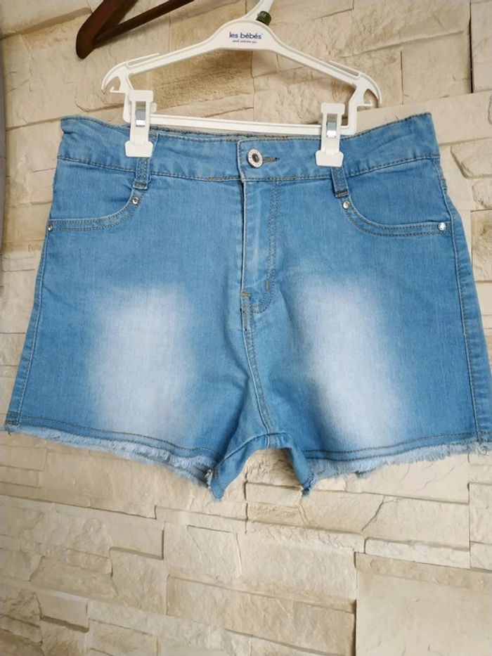 T-shirt fille bleu clair délavé tbe 14 ans