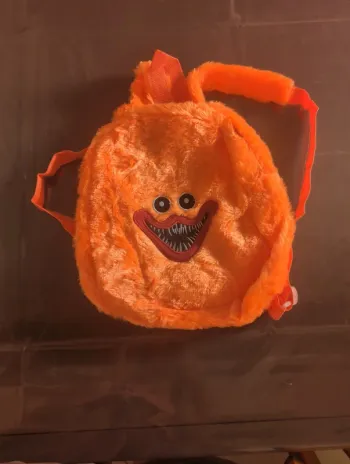 Sac a dos orange monstre