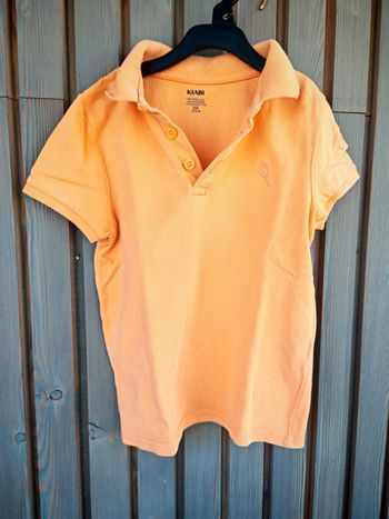Polo orange 6 ans