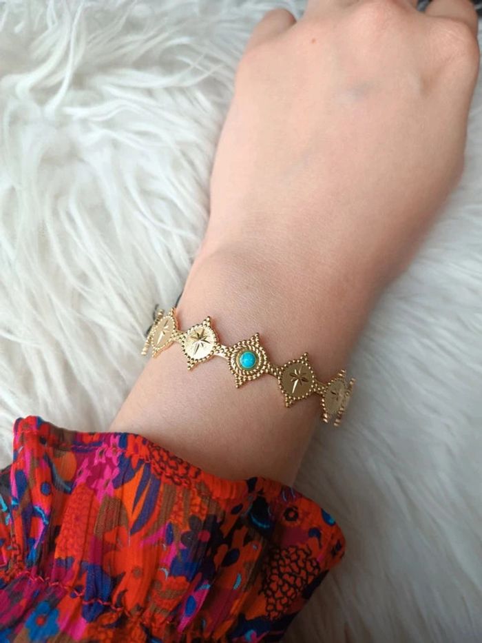 Bracelet jonc doré en acier inoxydable perle bleu Marque Somini Neuf