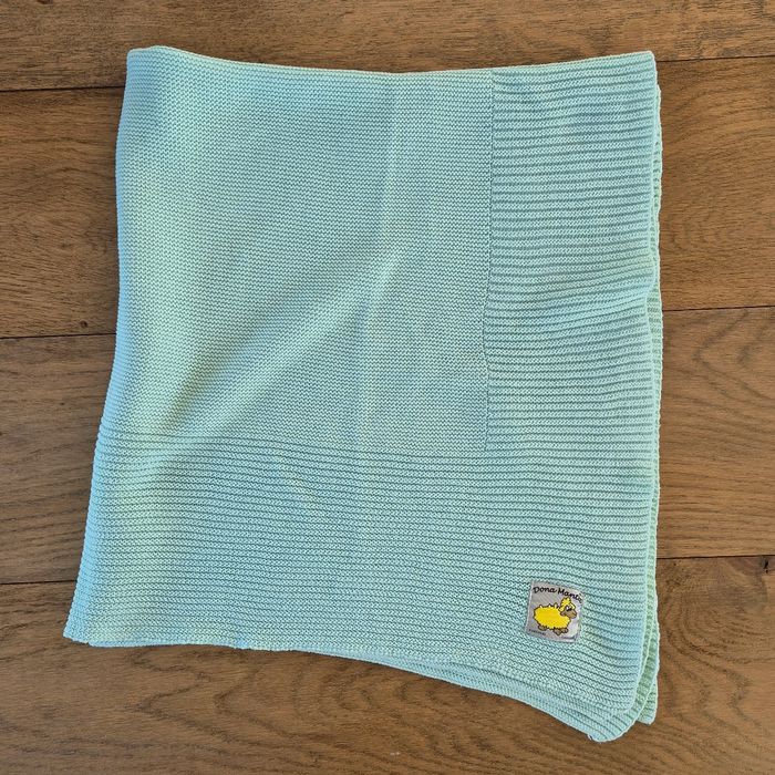Couverture verte tricotée
