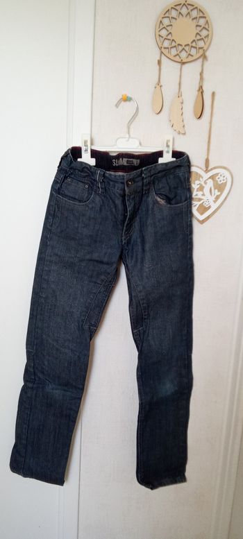 Jean garçon bleu Okaïdi en 10 ans effet ciré