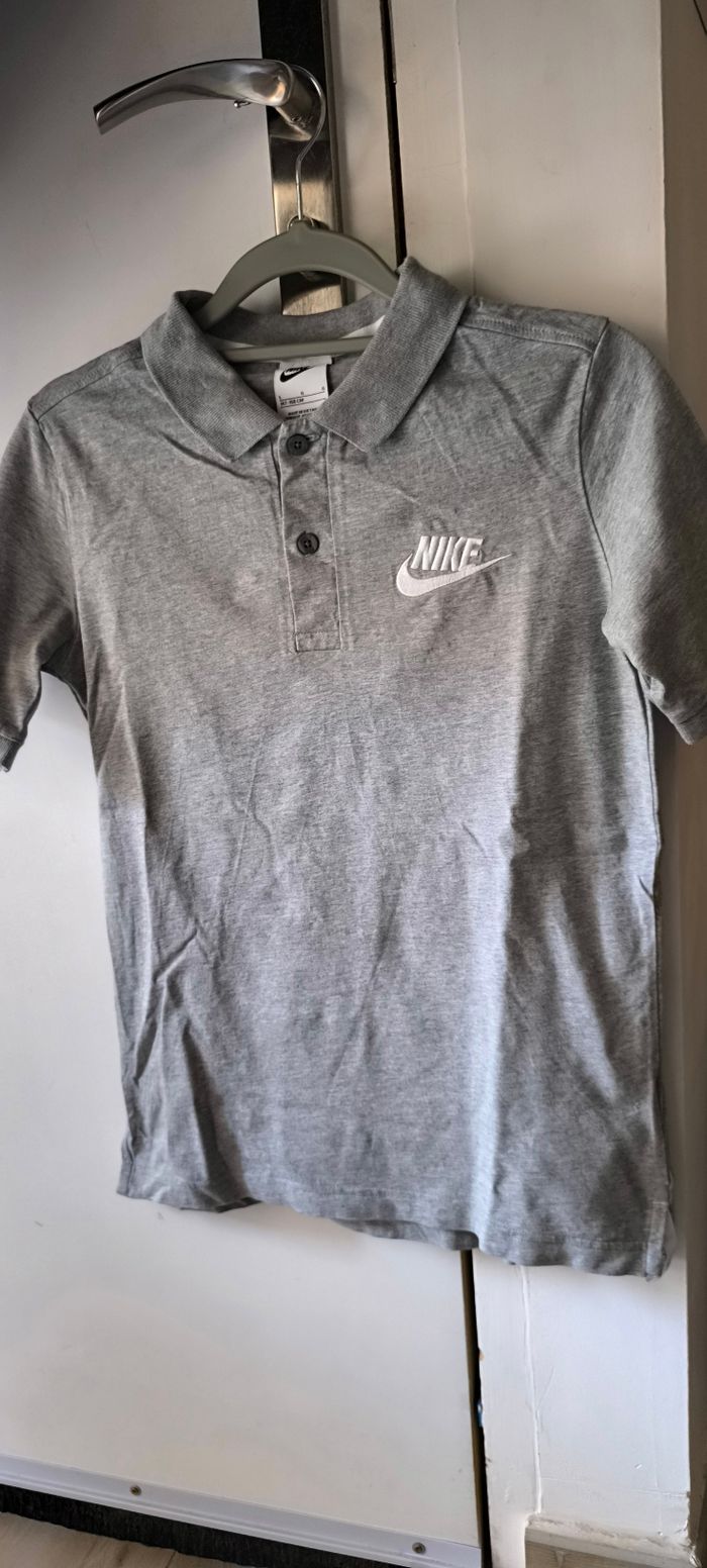Polo gris Nike taille L enfant