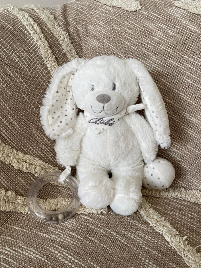 Peluche doudou 24cm pommette lapin d’éveil blanc à pois très bon état