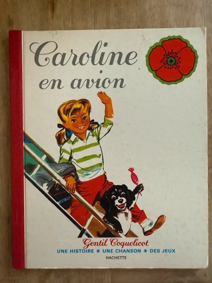Livre album ancien reliure rouge Caroline voyage en avion Gentil Coquelicot Hachette cartonné