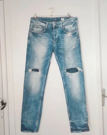 Jeans slim fit à trou homme