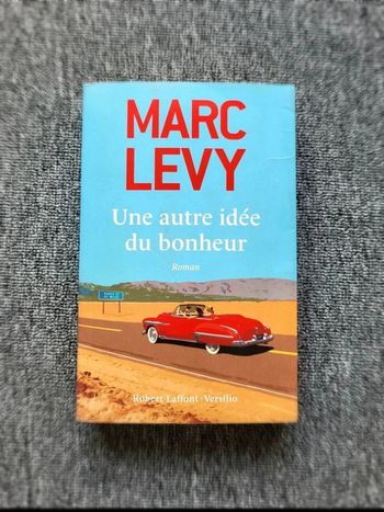 Livre Marc Levy – Une autre idée du bonheur – Roman broché – Édition Robert Laffont