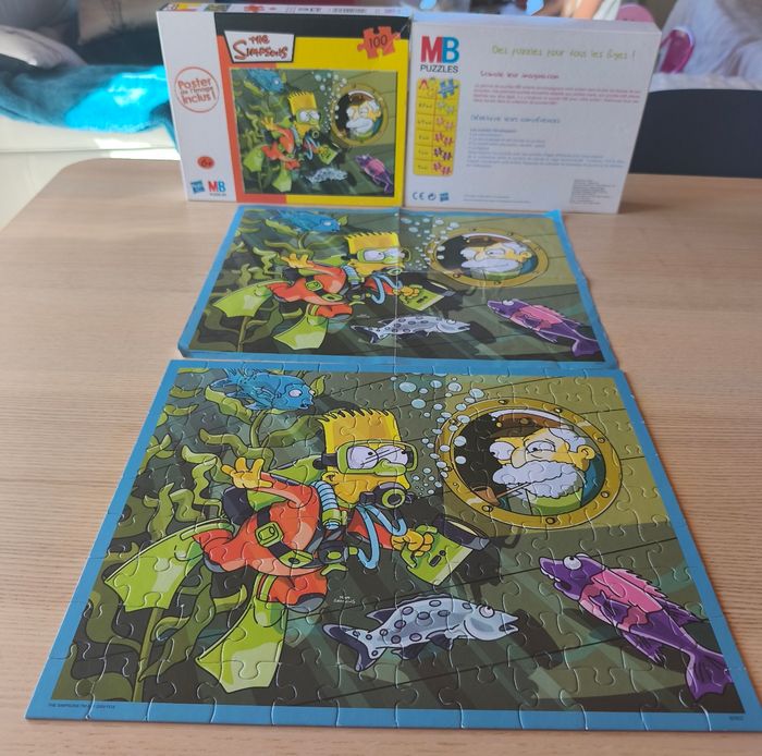 Puzzle Simpsons avec poster.