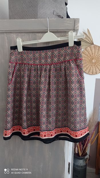 Jupe  Kookaï noire imprimée taille M comme neuve.
