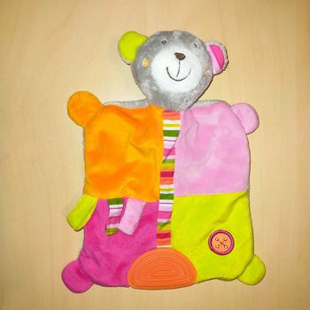 Doudou ours tête grelot multicolore Tigex