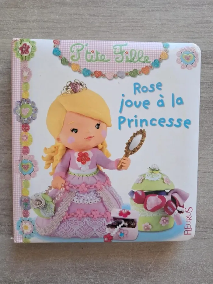 Livre petite fille rose joue a la princesse Fleurus