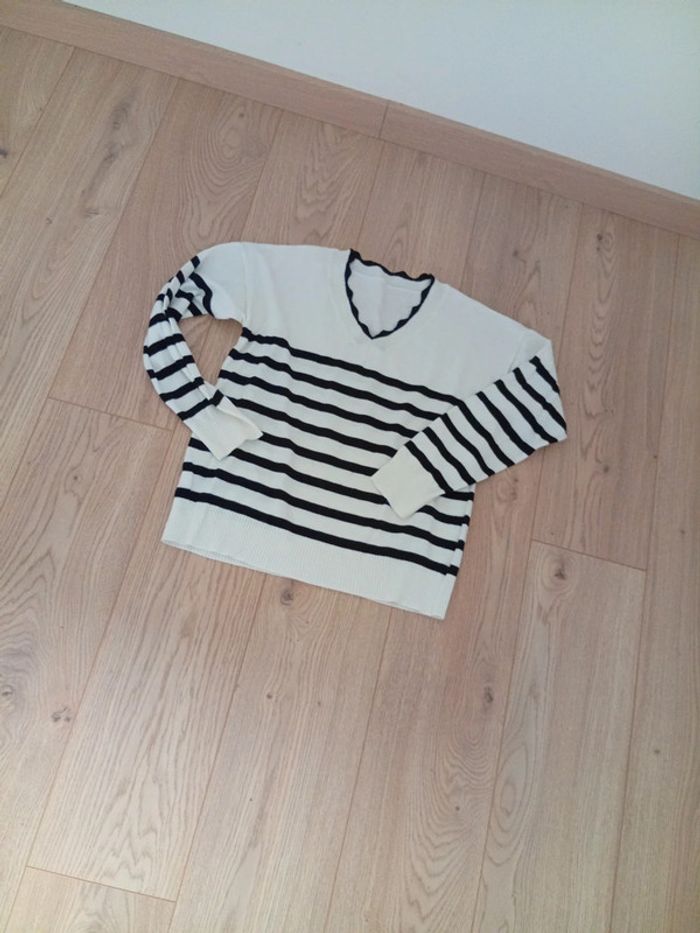 Pull taille s