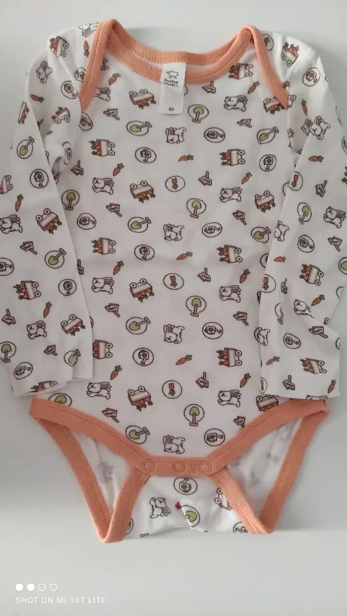Body blanc et orange motif jouets C&A