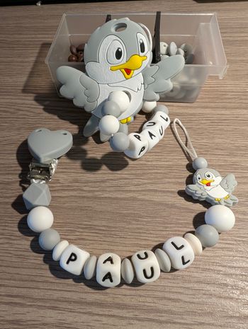Attache tétine oiseau 
