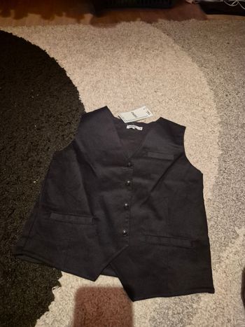 Boléro noir 8 ans neuf