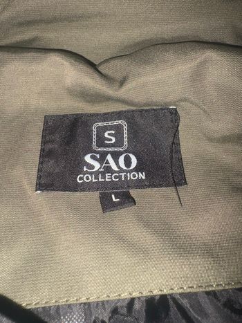 Veste stone island kaki en très bon état 