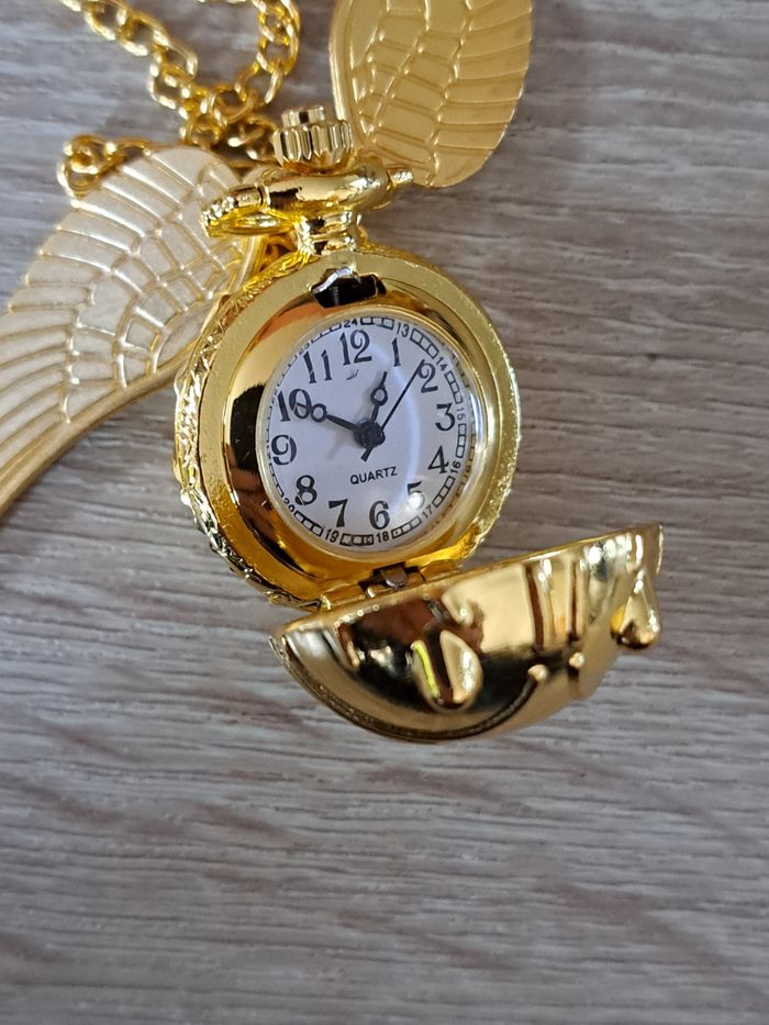 Montre pendentif Harry Potter Vif d' or vendue avec une pochette - photo numéro 6