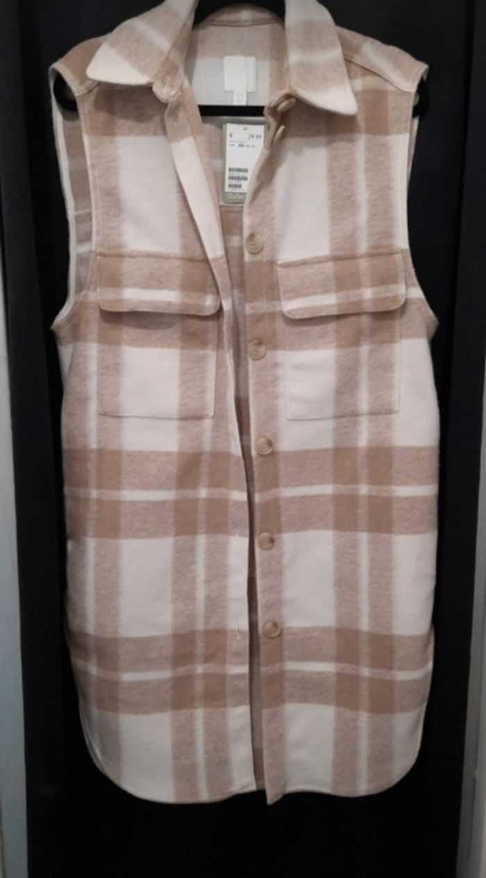 Surchemise chaude beige et blanche sans manche