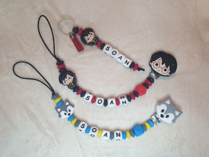 1 Attache tétine + 1 Attache tétine Idole + 1 porte clés