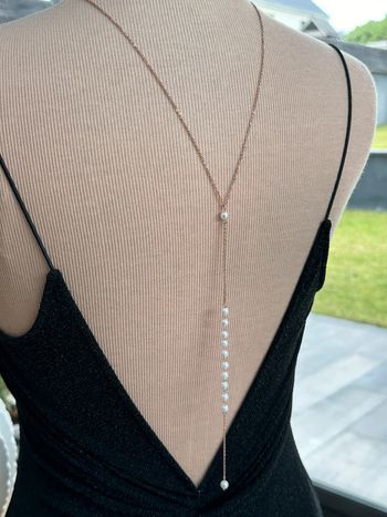 Collier dos en perles et acier or