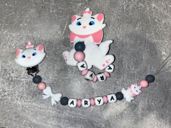 Ensemble attache tétine anneau de dentition