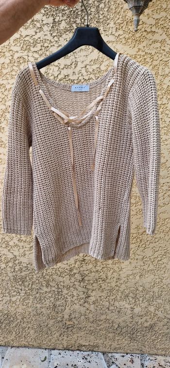 Pull avec ruban au col