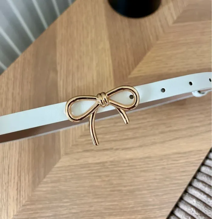Ceinture fine blanche à nœud doré – Taille unique – Neuve