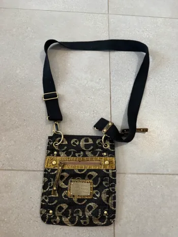 Sac à bandoulière noir et doré escensio, très bon état, 19*22cm