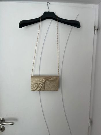 Pochette dorée pailletée noeud
