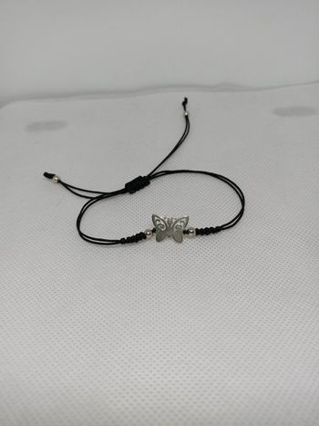 Bracelet papillon réglable neuf.