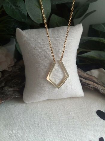 Collier porte alliance en acier doré et pierre cristal de roche