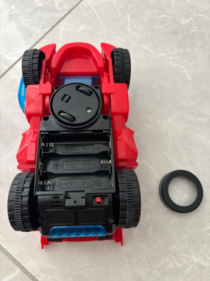 Jouet dinosaure /voiture qui se transforme avec sons et lumière avance seule rouge - photo numéro 8