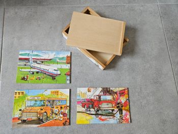 Boîte avec 3 puzzles en bois