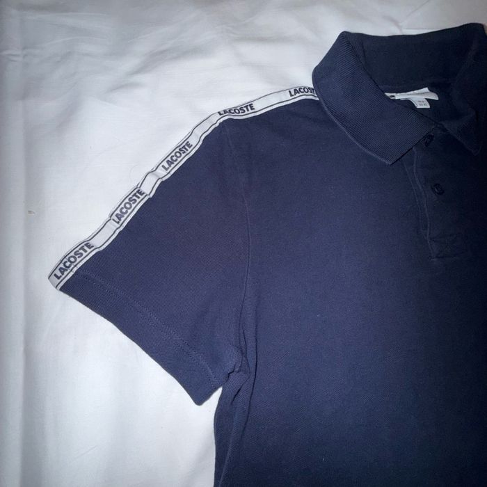 Polo Lacoste bleu marine taille XS. Comme neuf car porté une seule fois. - photo numéro 2