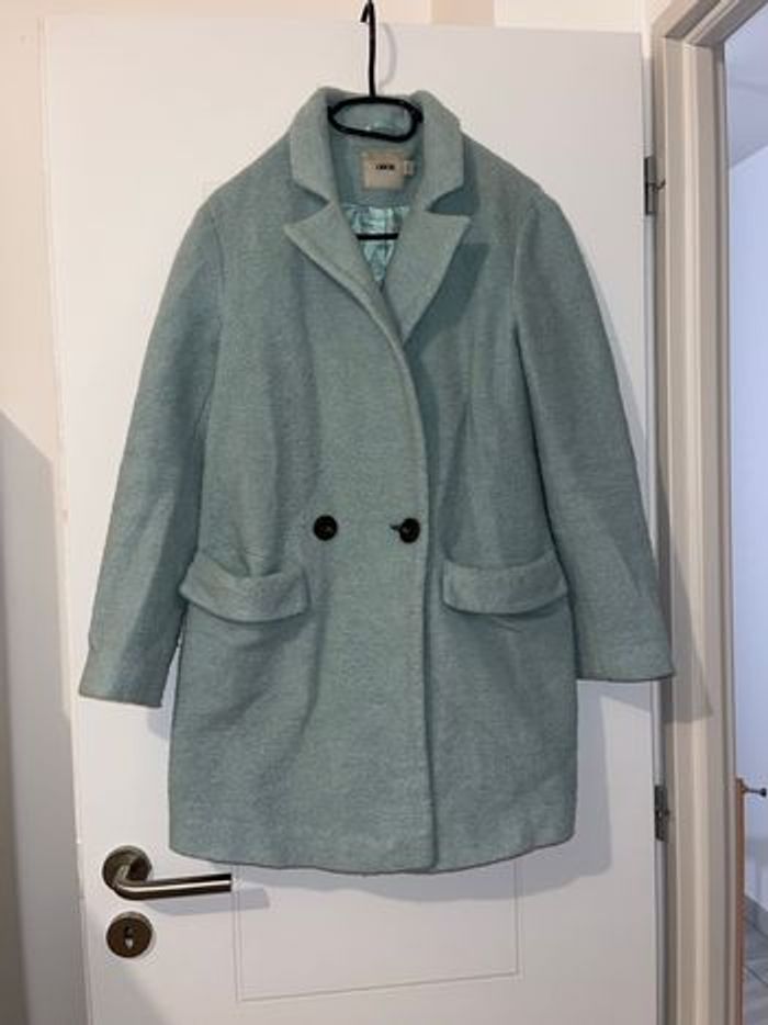 Manteau vert eau