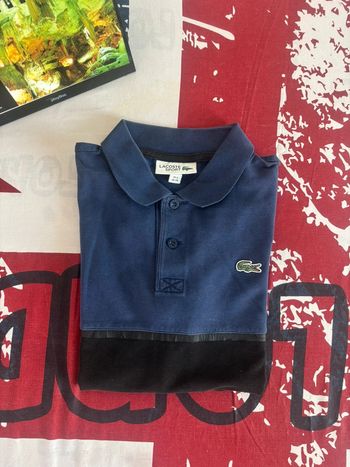 Polo Lacoste taille xs bleu et noir
