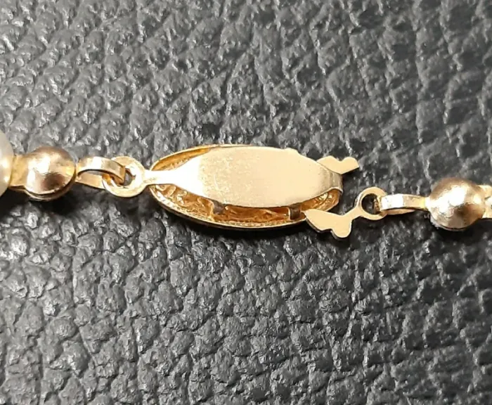 Très joli collier vintage en fausses perles noires, blanches et dorées. - photo numéro 6